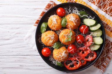 Italian arancini rice balls with cheese. horizontal top view