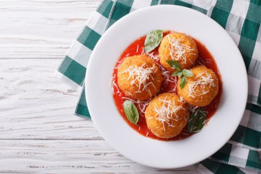 fried arancini rice balls with tomato sauce. horizontal top view clipart