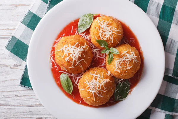 Fried arancini rice balls with tomato sauce closeup. horizontal — Stock fotografie