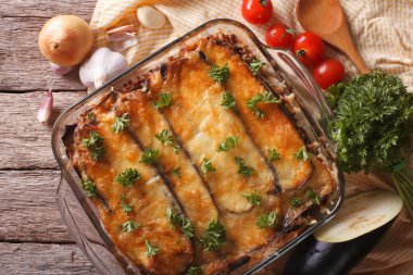 moussaka closeup in baking dish and ingredients. Horizontal top 