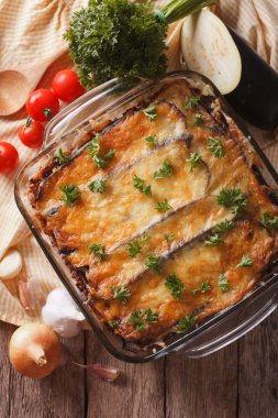 moussaka closeup in baking dish and ingredients. vertical top vi