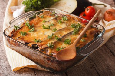Greek moussaka closeup in baking dish and ingredients. horizonta
