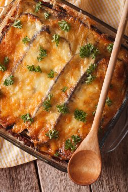 Traditional moussaka close up in baking dish. vertical top view
