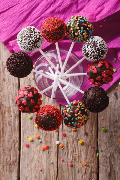 Delicious colorful cake pops in a glass. vertical top view — Zdjęcie stockowe