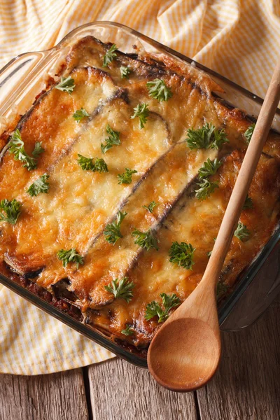 Greek moussaka with eggplant close up in baking dish. vertical t — Stock Fotó