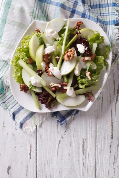 Waldorf Salad with apples, celery and walnuts on a plate. vertic — Zdjęcie stockowe