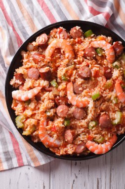 Creole jambalaya with shrimp and sausage close-up. vertical top