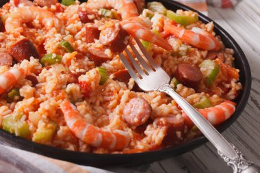 Creole jambalaya close-up on the table. horizontal
