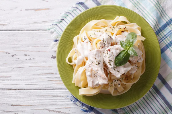Alfredo pasta in cream sauce with chicken. horizontal  top view — Stok fotoğraf