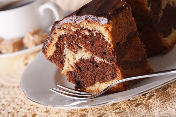 Piece of marble cake with chocolate macro and coffee. horizontal — Stock Photo, Image