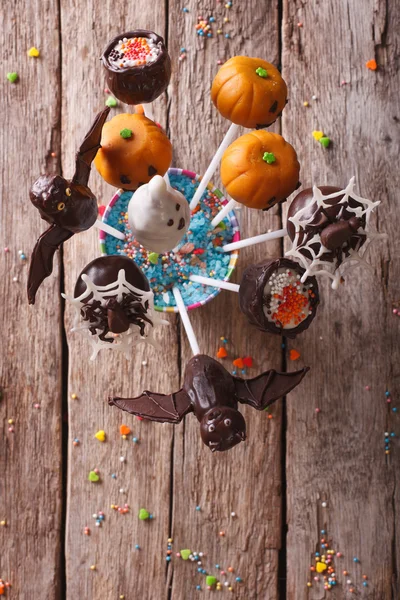 Halloween pop koláče na stůl. vertikální pohled shora — Stock fotografie