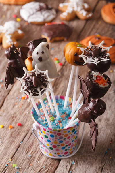 Delicious cake pop Halloween in a bucket on the table. vertical — Stock Photo, Image