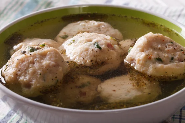 Canederli in a broth close up in a bowl. horizontal — Stock Photo, Image