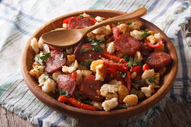 migas with chorizo, bread crumbs and vegetables close-up, horizo clipart