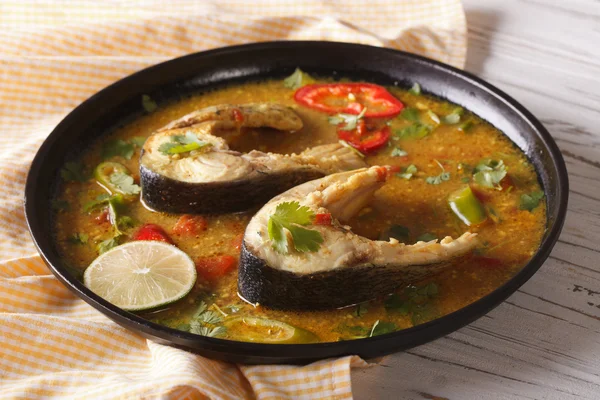 Indian fish curry with vegetables close-up. horizontal — Stock Image Indian fish curry with vegetables close-up. horizontal Stock Picture