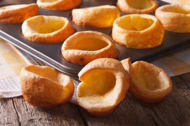 Yorkshire puddings in baking dish close up on the table. horizon