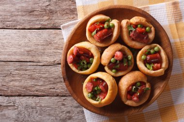 Yorkshire puddings with sausage and green peas horizontal top vi