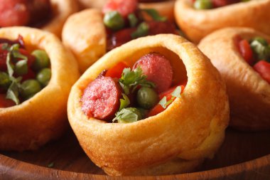 Yorkshire pudding with sausages macro. horizontal