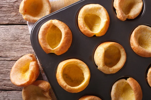 Fresh Yorkshire puddings in baking dish macro. horizontal top vi — Zdjęcie stockowe