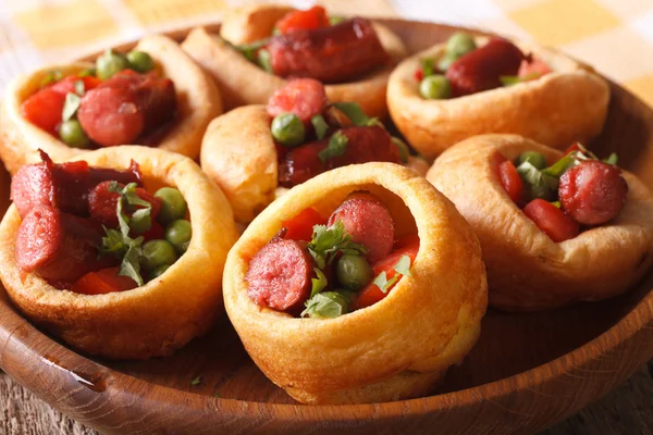 Homemade Yorkshire pudding with sausages close-up. Horizontal — Stockfoto