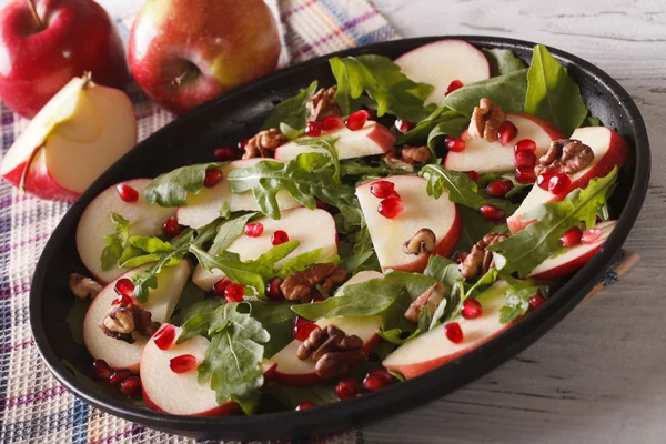 Apple salad with pomegranate, nuts and arugula close-up. horizon — Stock Photo, Image