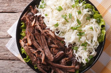 Homemade Pulled pork with sauerkraut closeup. horizontal top vie clipart