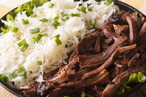 Pulled pork with sauerkraut on a plate macro. horizontal — Stock Photo, Image