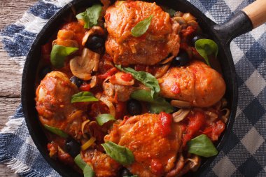 Cacciatori Chicken with mushrooms closeup in a pan. horizontal t