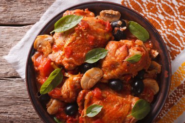 Italian Cacciatori chicken closeup on a plate. horizontal top vi