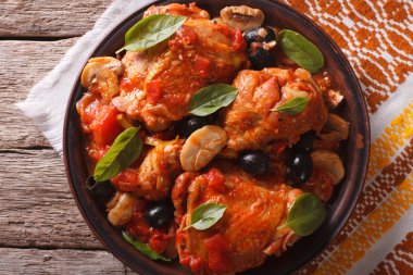 Homemade Cacciatori chicken on a plate close-up. horizontal top 
