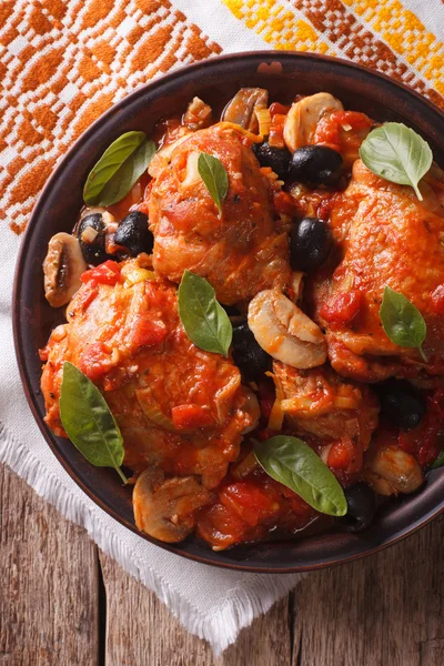 Italian Cacciatori chicken closeup on a plate . vertical top vie — Stock fotografie