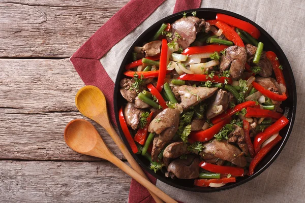 Fried chicken liver  with vegetables on a dish. horizontal top v — Stock Photo, Image