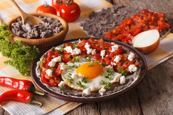 Mexican breakfast: huevos rancheros close-up. Horizontal — Stock Photo, Image