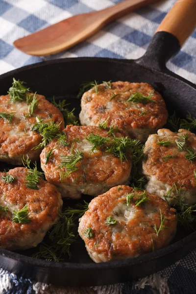 Fishcakes with herbs close-up in a pan. vertical — Stock Photo, Image