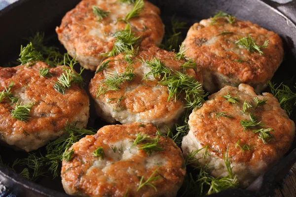 Fish cakes with dill macro in a pan. Horizontal — Stock Photo, Image