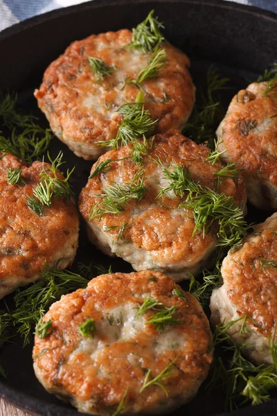 Fish cakes with dill macro in a pan. vertical — Stock Photo, Image