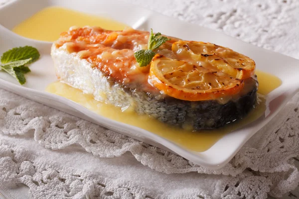 Baked salmon steak with orange sauce on a plate. horizontal — Stock Photo, Image