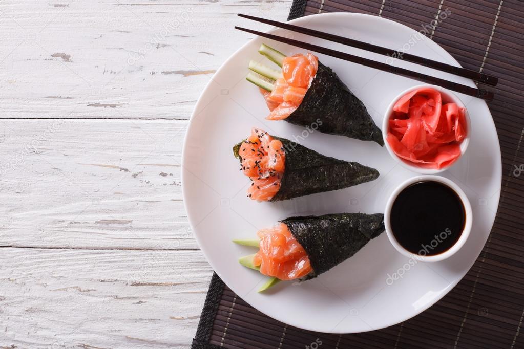 Japanese food: Salmon temaki, ginger and sauce. Horizontal top v