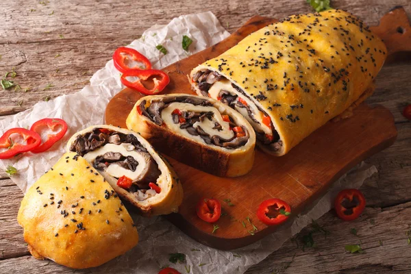 Potato roll with forest mushrooms and pepper close-up. Horizonta — Stock Photo, Image