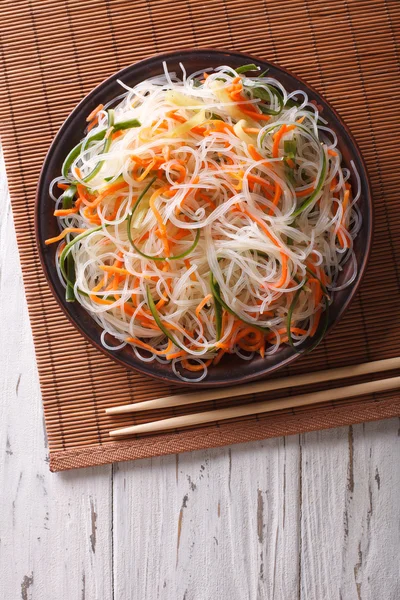 Crystal noodles with cucumber and carrot on a plate Vertical top — Stock Photo, Image