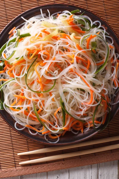 Chinese noodles with cucumber and carrot close-up. Vertical top — Stock Photo, Image