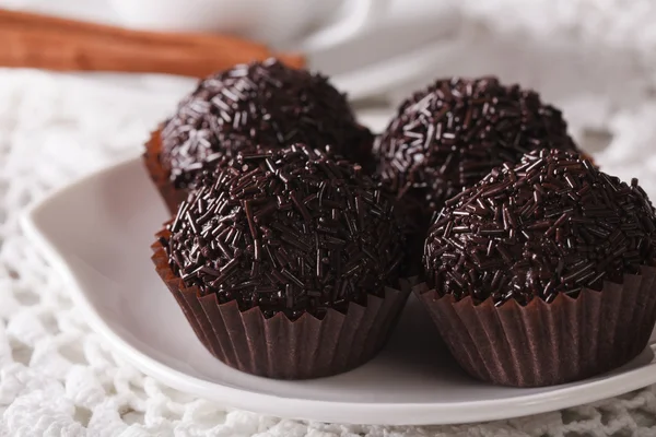 Latin American Brigadeiro truffles on a plate macro. horizontal — Stock Photo, Image