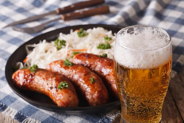 Lager beer and snacks of sausages and sauerkraut — Stock Photo, Image