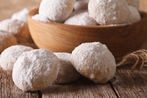 Mexican wedding cookies polvoron macro in a bowl. horizontal