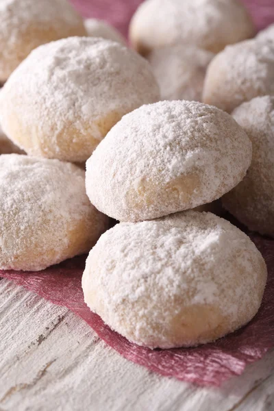 Polvoron cookies with powdered sugar macro on a table. Vertical — Stock Photo, Image