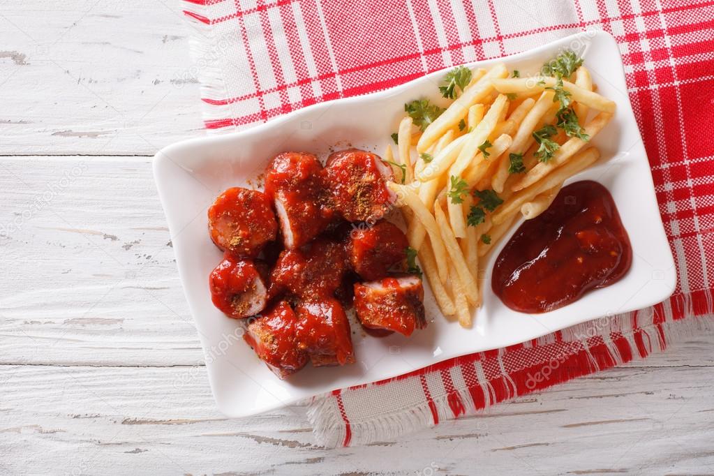 German cuisine: currywurst with french fries. Horizontal top vie