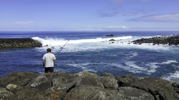 Man fishing in the atlantic ocean — Stock Photo, Image