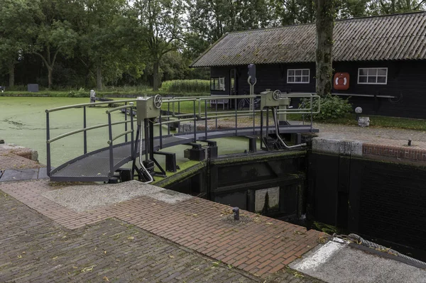 A very old sluice in diever in holland — Stock Photo, Image