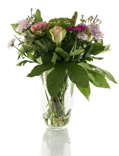 Vase with bouquet of different flowers — Stock Photo, Image