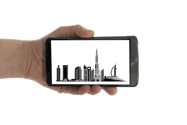 Ręka z telefonu komórkowego panoramę Dubaju — Zdjęcie stockowe